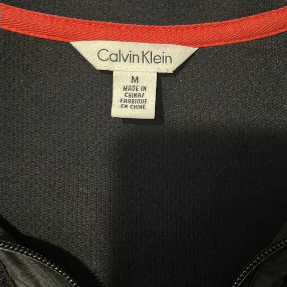 Calvin Klein Black Garment with Red Accent